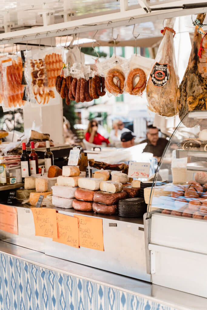 Mallorca street market stall with Mahon cheese and cured meats