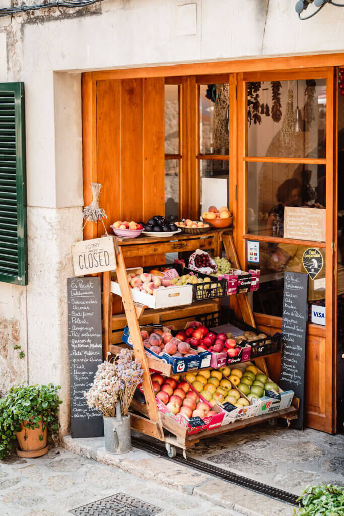Rustic storefront and fresh fruit display in Valldemossa Mallorca