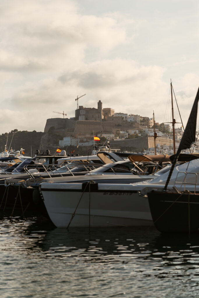 Boats in Ibiza harbor with the Dalt Vila old town in the background