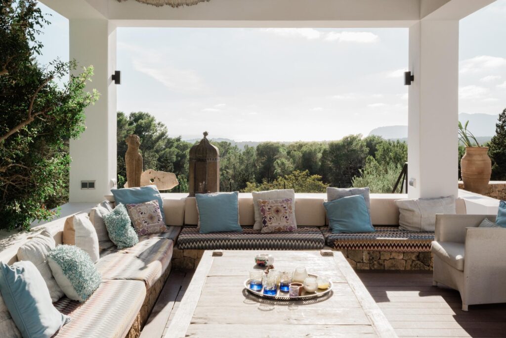 Covered outdoor lounge overlooking the hills at Casa Amalia