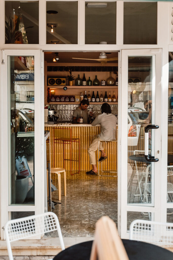 Bar interior with guests seated at the counter in Ibiza