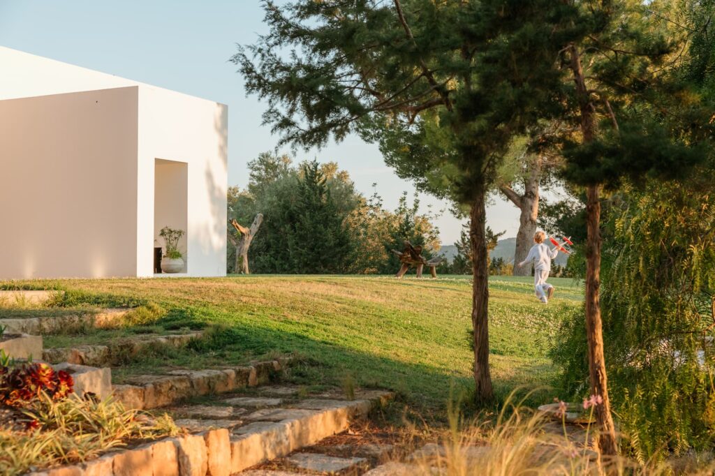 Child playing in the garden of Ibiza luxury villa Can Zama