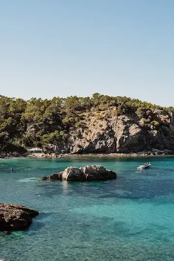Thumbnail of Cala Xarraca beach in Ibiza with clear water and rocky cove