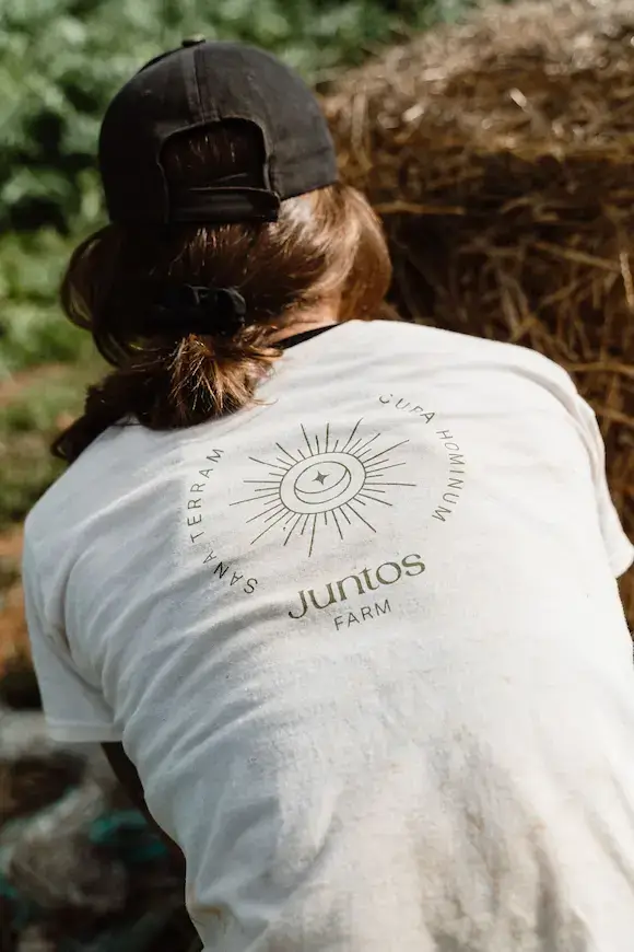 Farm worker at Juntos Farm in Ibiza practicing regenerative farming and sustainable agriculture