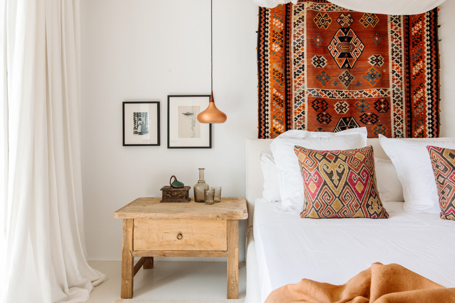 Bedroom with colorful textiles and handcrafted decor at Finca Selva in Ibiza