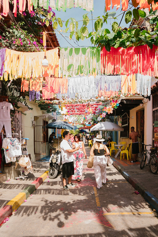 Colorful festive decorations lining a street in Cartagena, Colombia