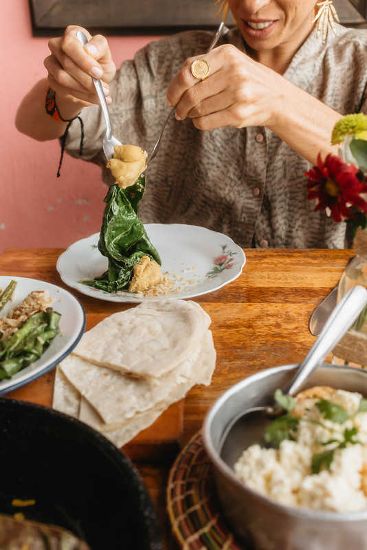 person-eating-flatbread-meal