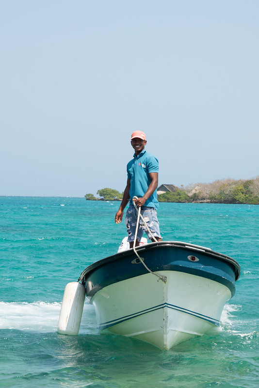 Local fisherman on a boat in the waters around Isla Barú, Colombia