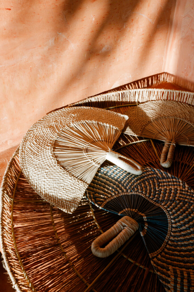 Handwoven baskets and traditional palm hats at a luxury villa in the Rosario Islands, Colombia