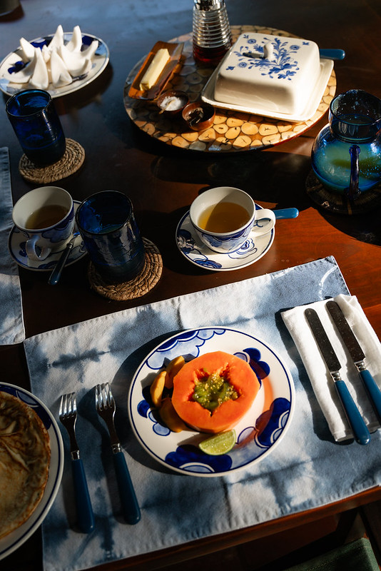 Tropical breakfast with fresh papaya and coffee served at a luxury villa in the Rosario Islands, Colombia