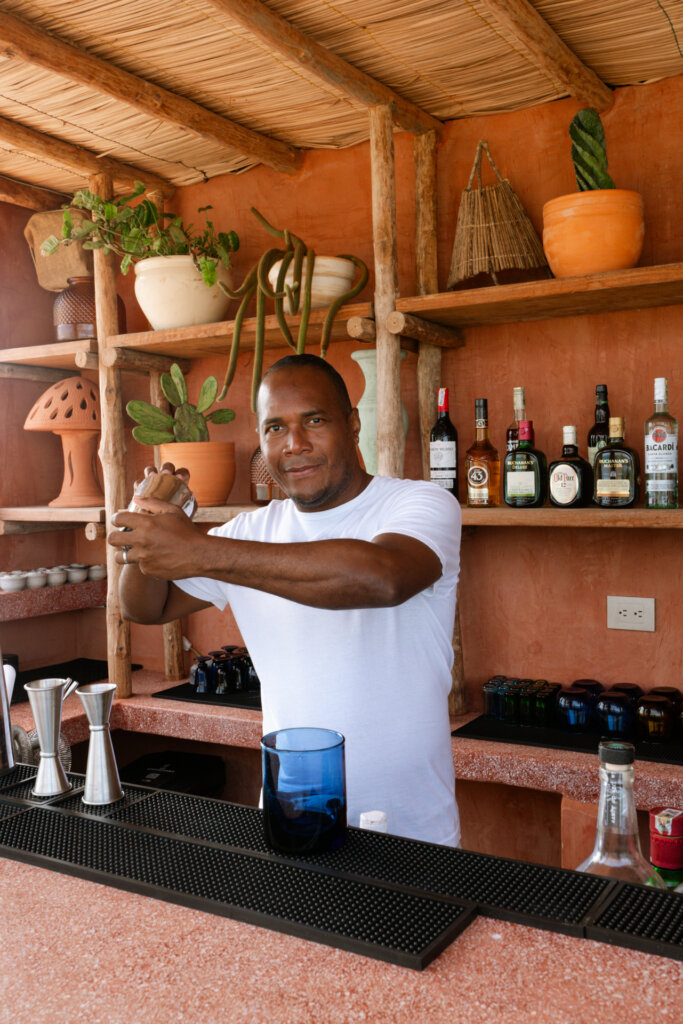 Bartender preparing drinks at a tropical luxury villa in the Rosario Islands, Colombia