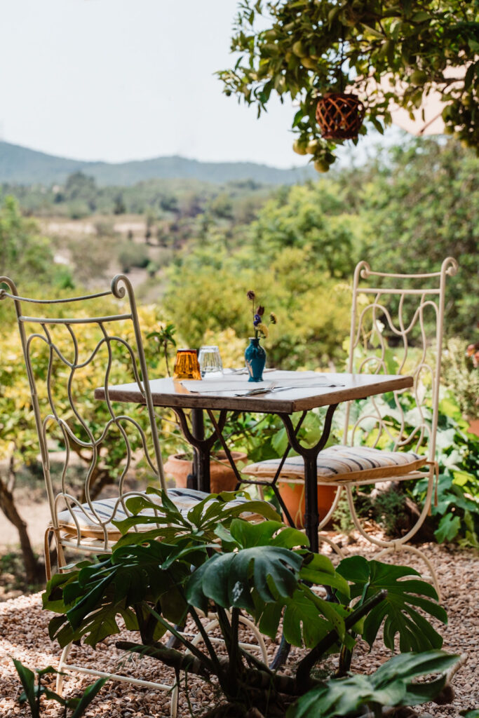 Garden table for two overlooking the countryside at La Paloma, Ibiza.