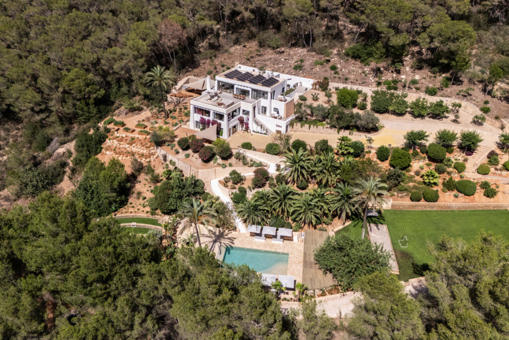 Villa Lunara, pool, garden and surrounding forest seen from above.