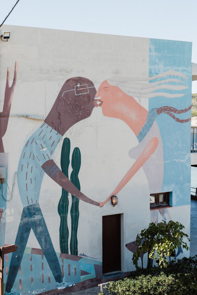 The outside of Los Enamorados boutique hotel in Portinatx Ibiza, also with popular boutique and restaurant open all day from breakfast to dinner