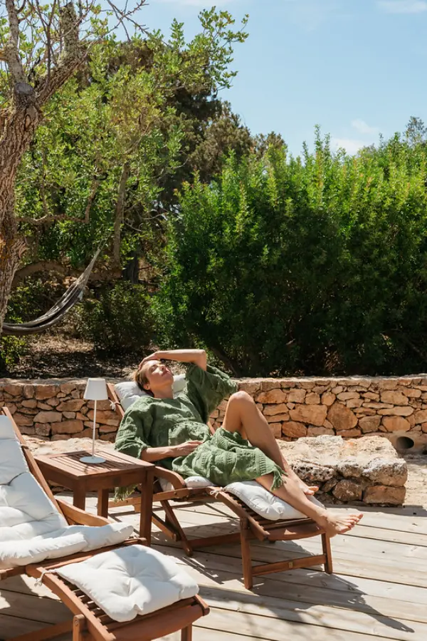 Marcia lying on a sun lounge at Casa Parra enjoying the sunshine