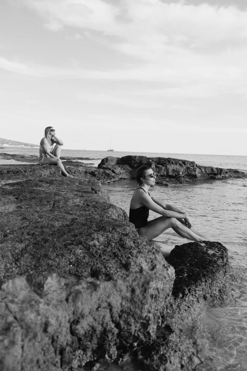 Emma and Marcia, founders of Maven Collection, together in black and white looking out to sea