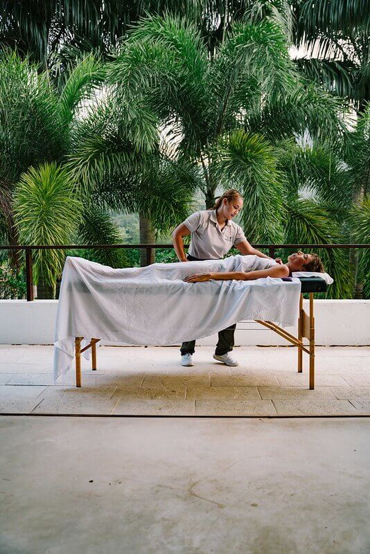 Outdoor massage beside tropical gardens at a luxury villa in Antioquia, Colombia