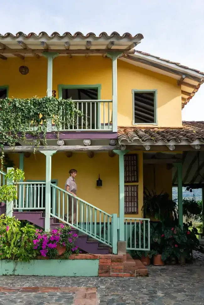 Woman enjoying the gardens at Hacienda Oro Molido in Antioquia, Colombia
