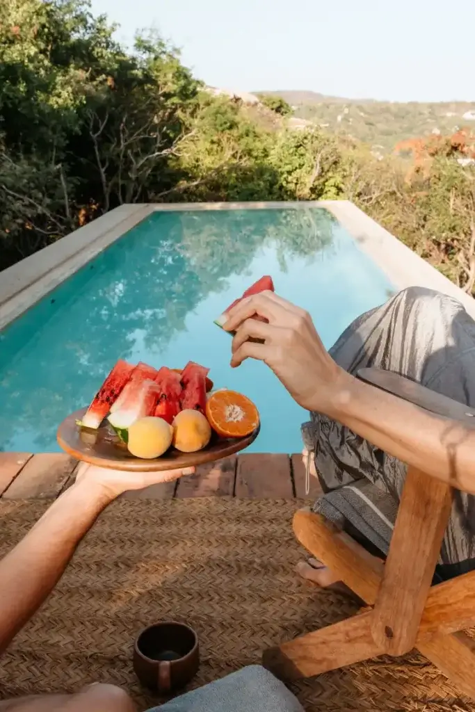 Fresh watermelon and fruit shared beside the pool at Casa Nahual in Mazunte