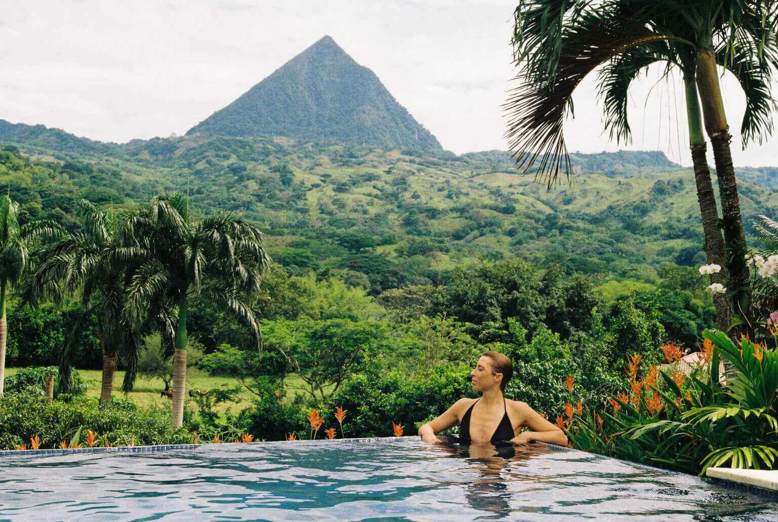 Woman relaxing in the pool at Villa Tusa in Antioquia, Colombia
