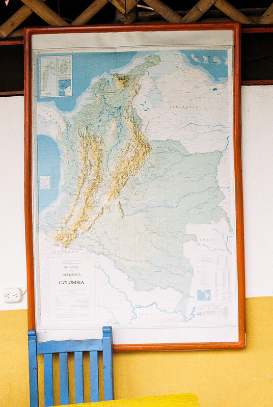 Map of Colombia displayed on a wall in a local setting