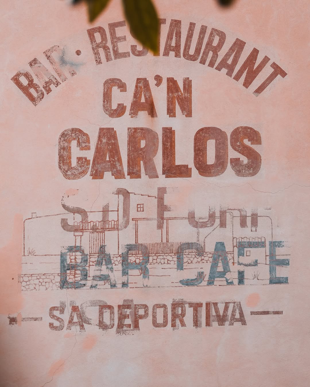 Hand-Painted Wall Sign at Can Carlos Restaurant