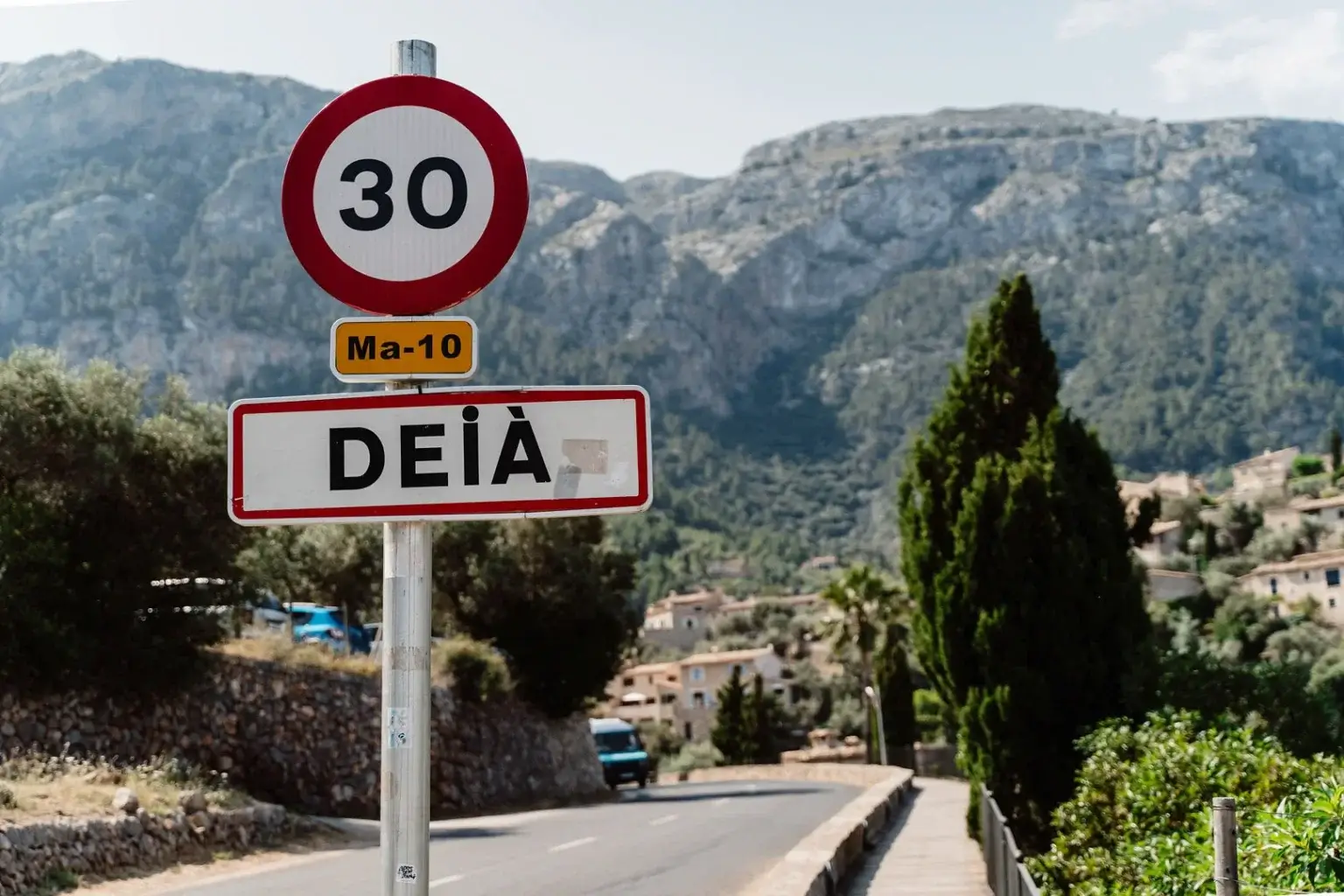 Cala de Deià with rocky coastline and clear turquoise Mediterranean water in Mallorca, Spain