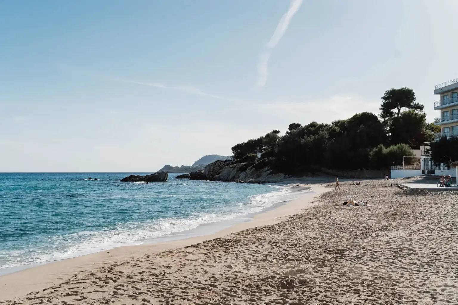 Mallorca beach with clear turquoise water and rocky coastline