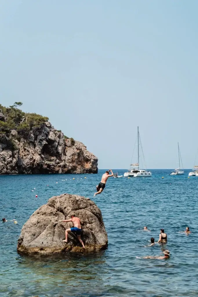 Mallorca beach with clear turquoise water and rocky coastline
