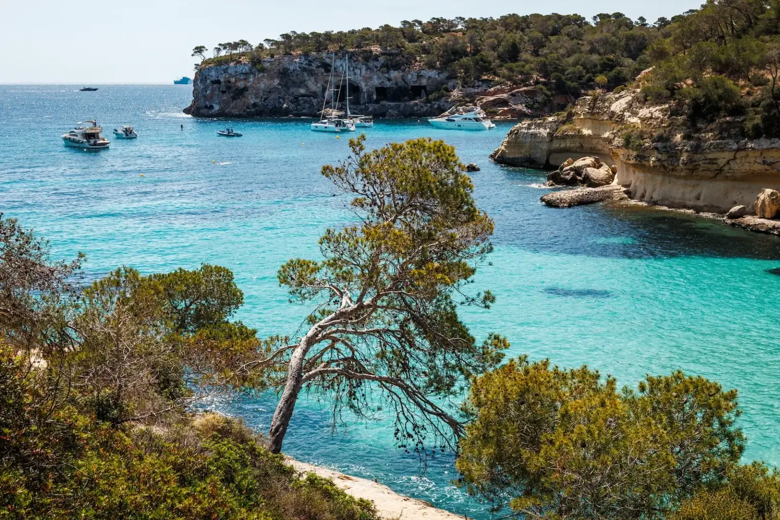 Sa Platgeta des Portals Vells, a small sandy cove surrounded by rocky cliffs in Mallorca, Spain