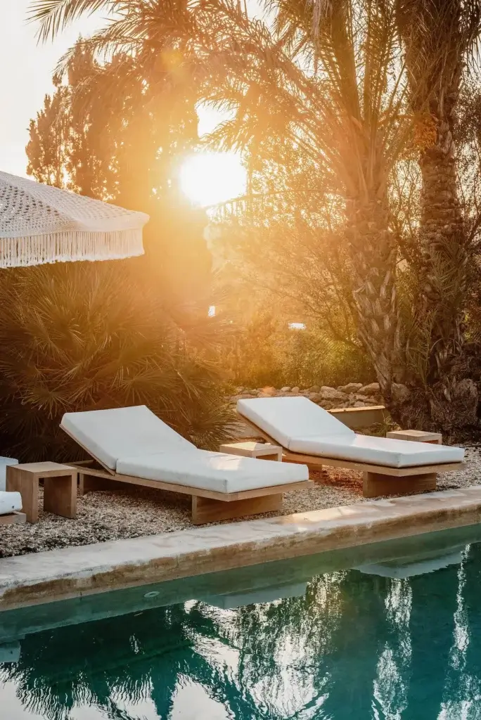 Sun setting over a poolside lounger at Can Sabina
