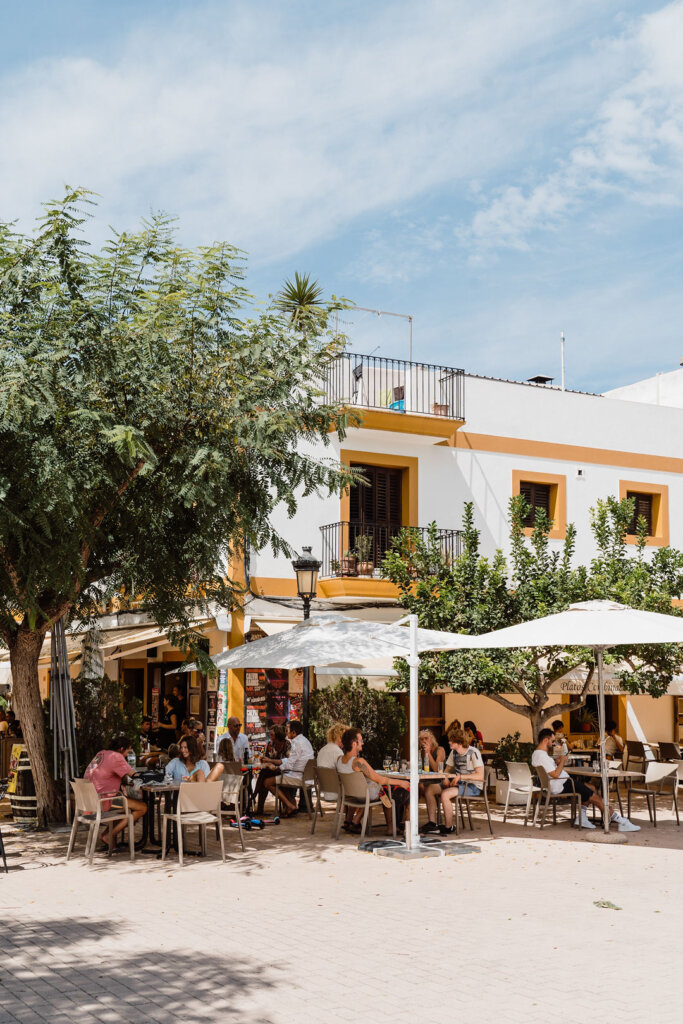 Café terraces and diners in Santa Gertrudis town square, Ibiza.